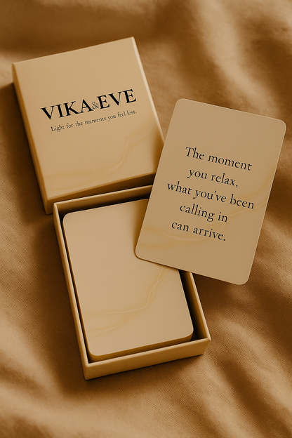 VIKA&EVE guidance card deck in an open box with a quote card on soft fabric.